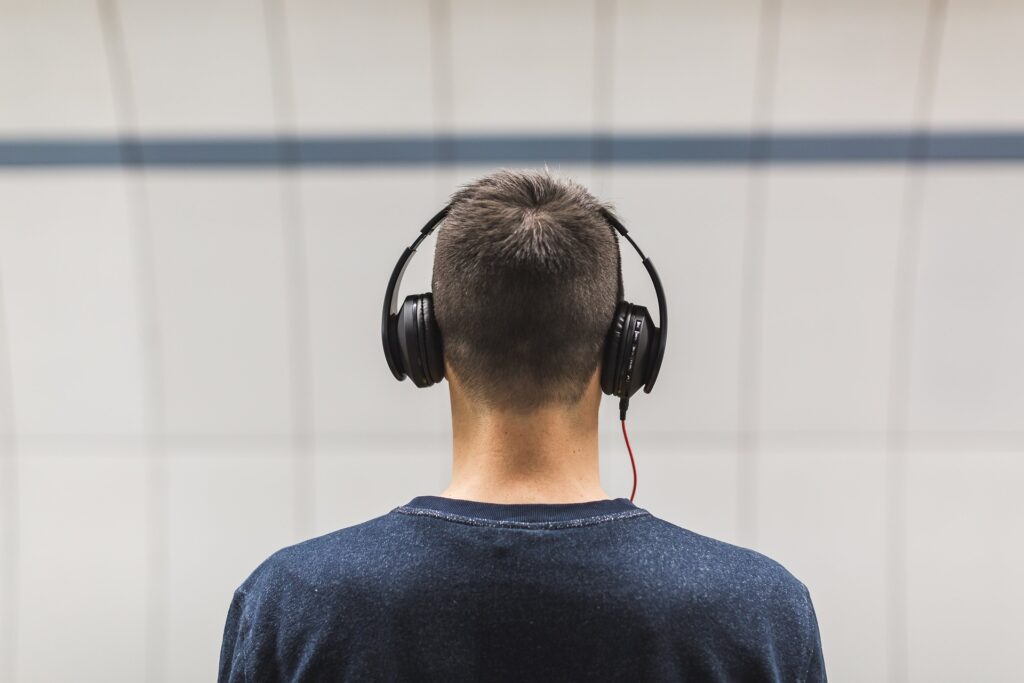 Man-Standing-Train station - Headphones